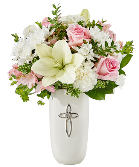 Elegant sympathy arrangement with roses, alstroemeria, carnations and lilies.