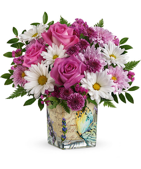 White, pink and lavender flowers in a designer cube vase