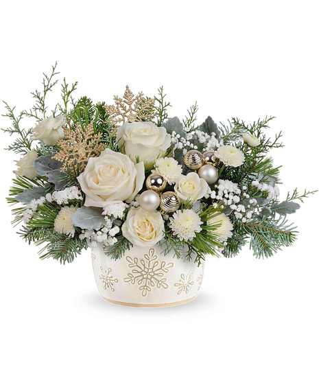 White Christmas arrangement arranged in a snowflake inspired vase.