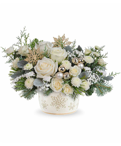 White Christmas arrangement arranged in a snowflake inspired vase.