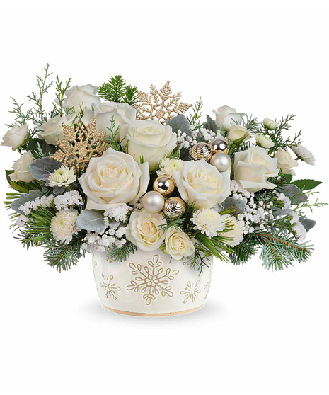 White Christmas arrangement arranged in a snowflake inspired vase.