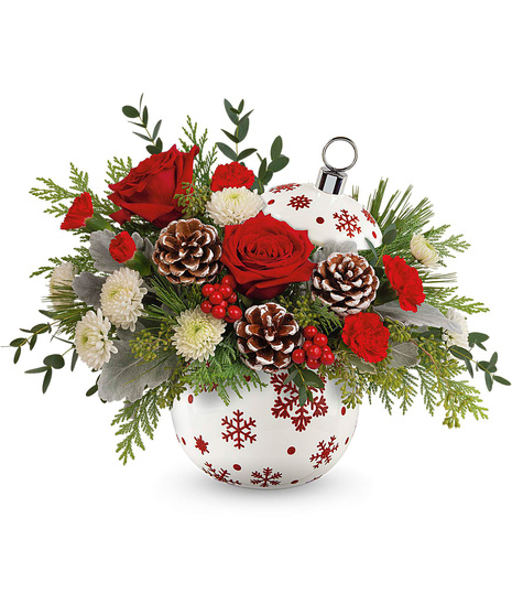 Christmas arrangement designed in a red and white ornament vase.