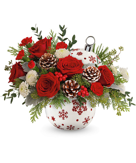 Christmas arrangement designed in a red and white ornament vase.