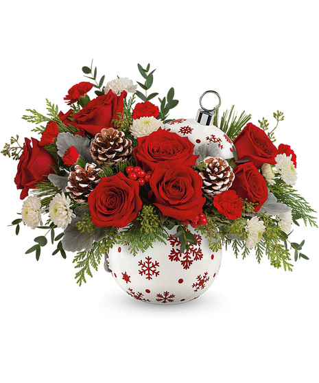 Christmas arrangement designed in a red and white ornament vase.