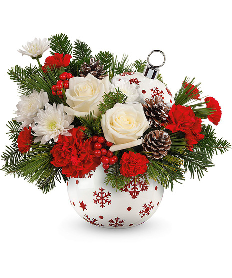 Christmas arrangement designed in a red and white ornament vase.