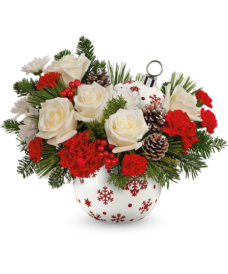 Christmas arrangement designed in a red and white ornament vase.