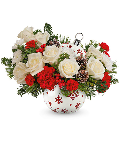 Christmas arrangement designed in a red and white ornament vase.