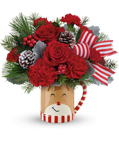 Christmas blooms arranged in a Reindeer wish mug