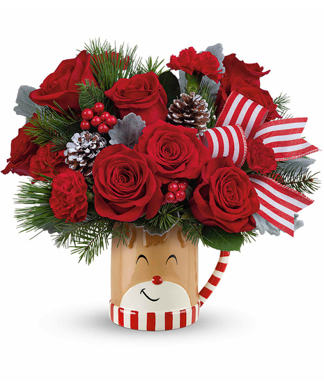 Christmas blooms arranged in a Reindeer wish mug