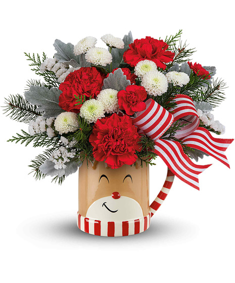 Christmas blooms arranged in a Reindeer wish mug