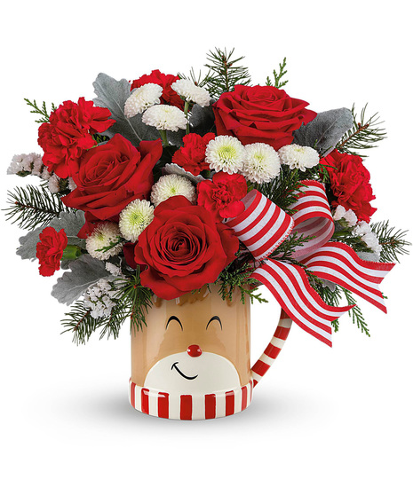 Christmas blooms arranged in a Reindeer wish mug