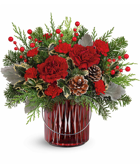 Christmas flowers designed in a vase that can be used as a candleholder afterwards.