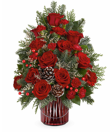 Christmas Tree inspired floral arrangement includes a Merry Glow Lantern