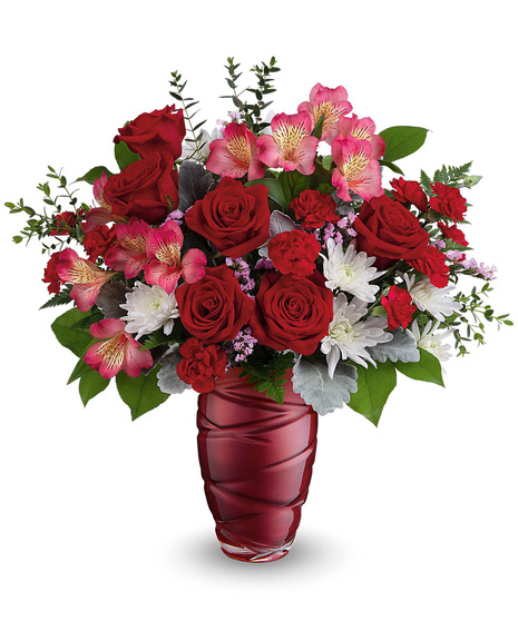 Elegant red vase with red roses, white chrysanthemums and more beautiful flowers.