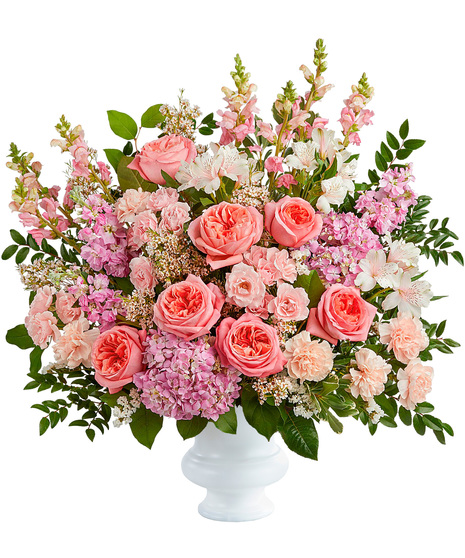 Funeral tribute flower arrangement in pink tones