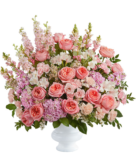 Funeral tribute flower arrangement in pink tones