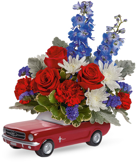 Red, white and blue flowers in a 1965 Ford Mustang Keepsake